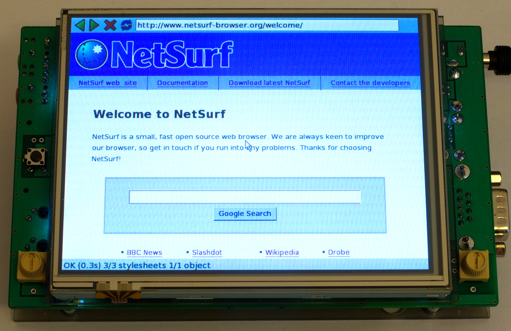 DePicture system showing the NetSurf welcome page.
